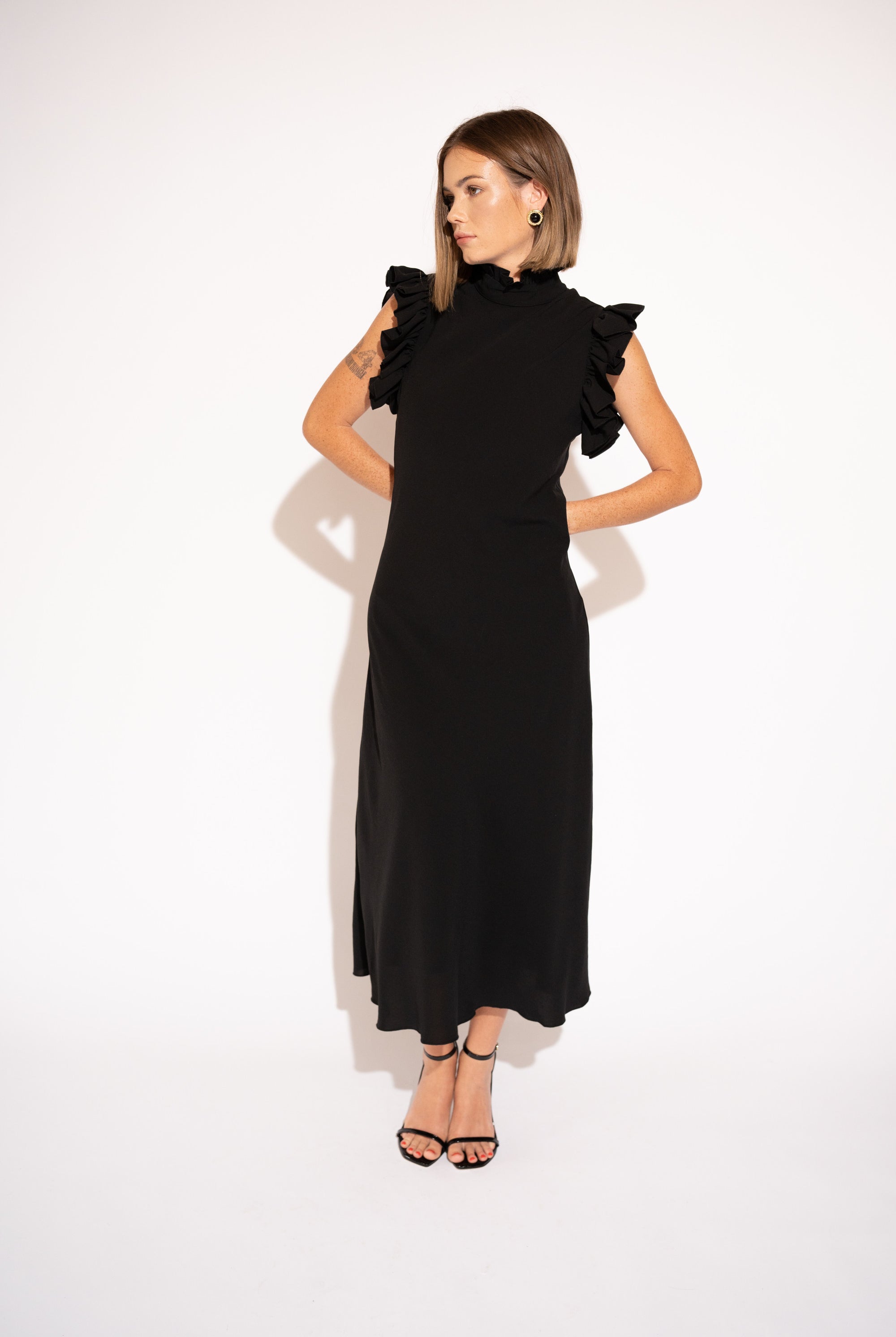 Alternate front view with white background of High-Neck Ruffle Sleeve Maxi Dress – Black.