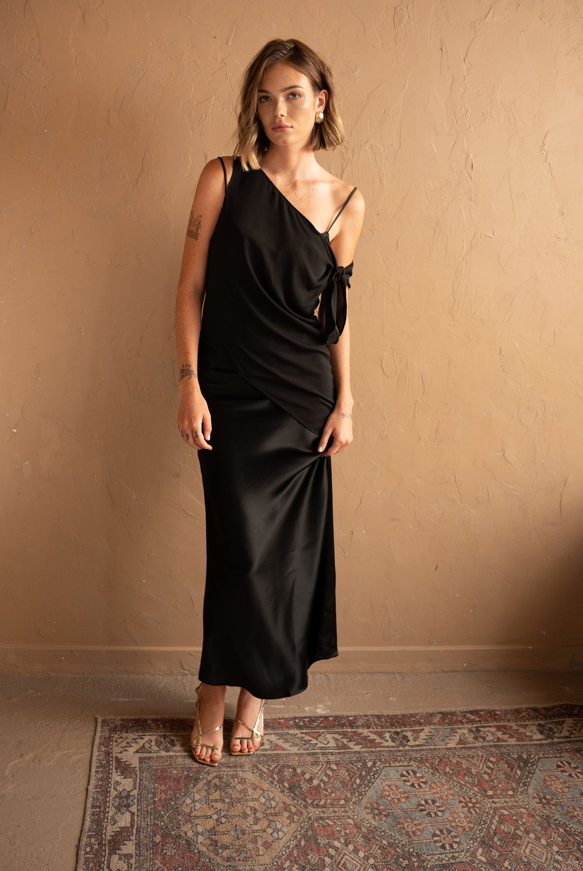 Front view of Asymmetrical Mesh-Spliced Satin Maxi Dress – Black by Aisl.