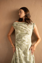 Front view with alternative model position of Draped Printed Midi Dress – Sage Green by Aisl.