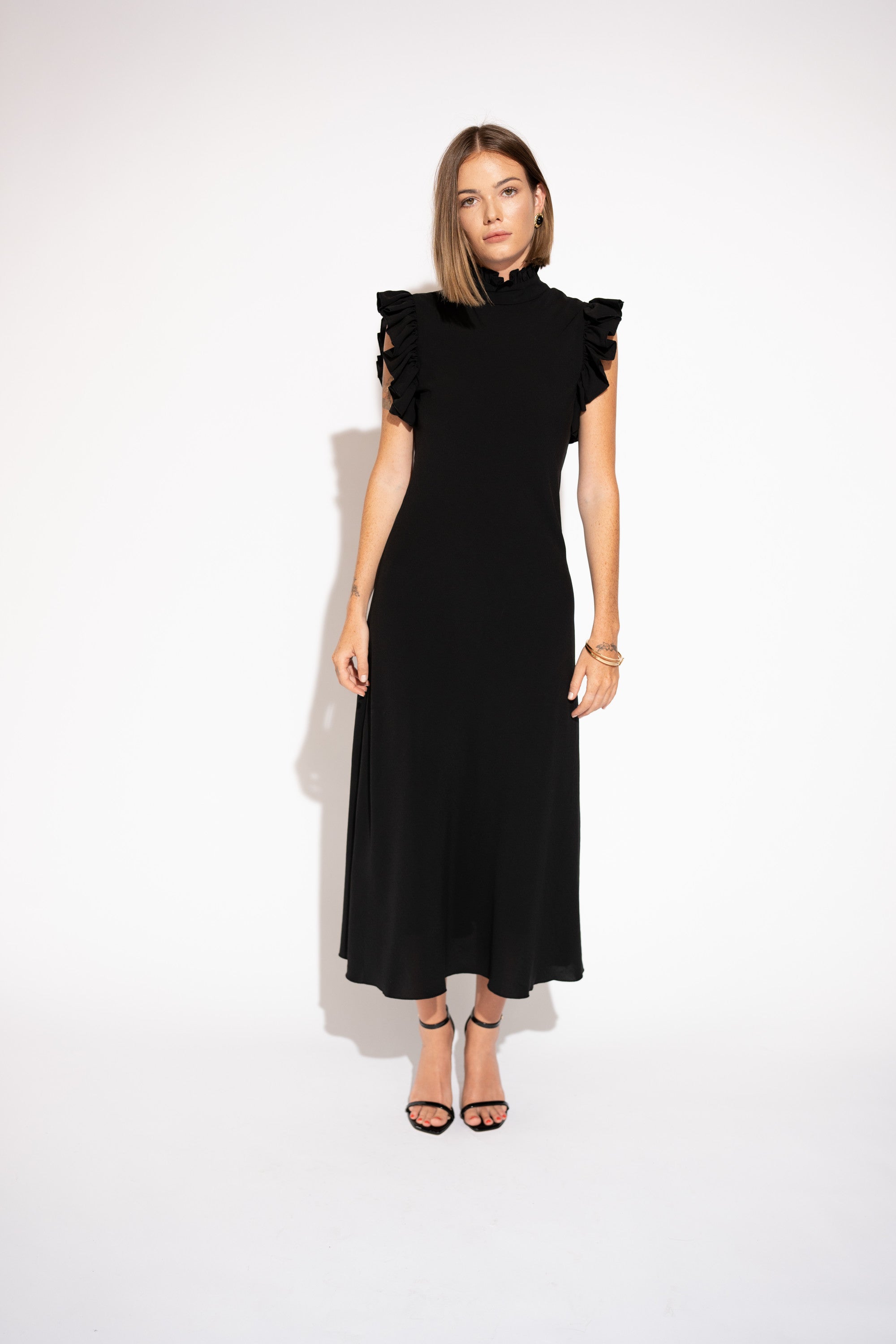 Front view with white background of High-Neck Ruffle Sleeve Maxi Dress – Black. 
