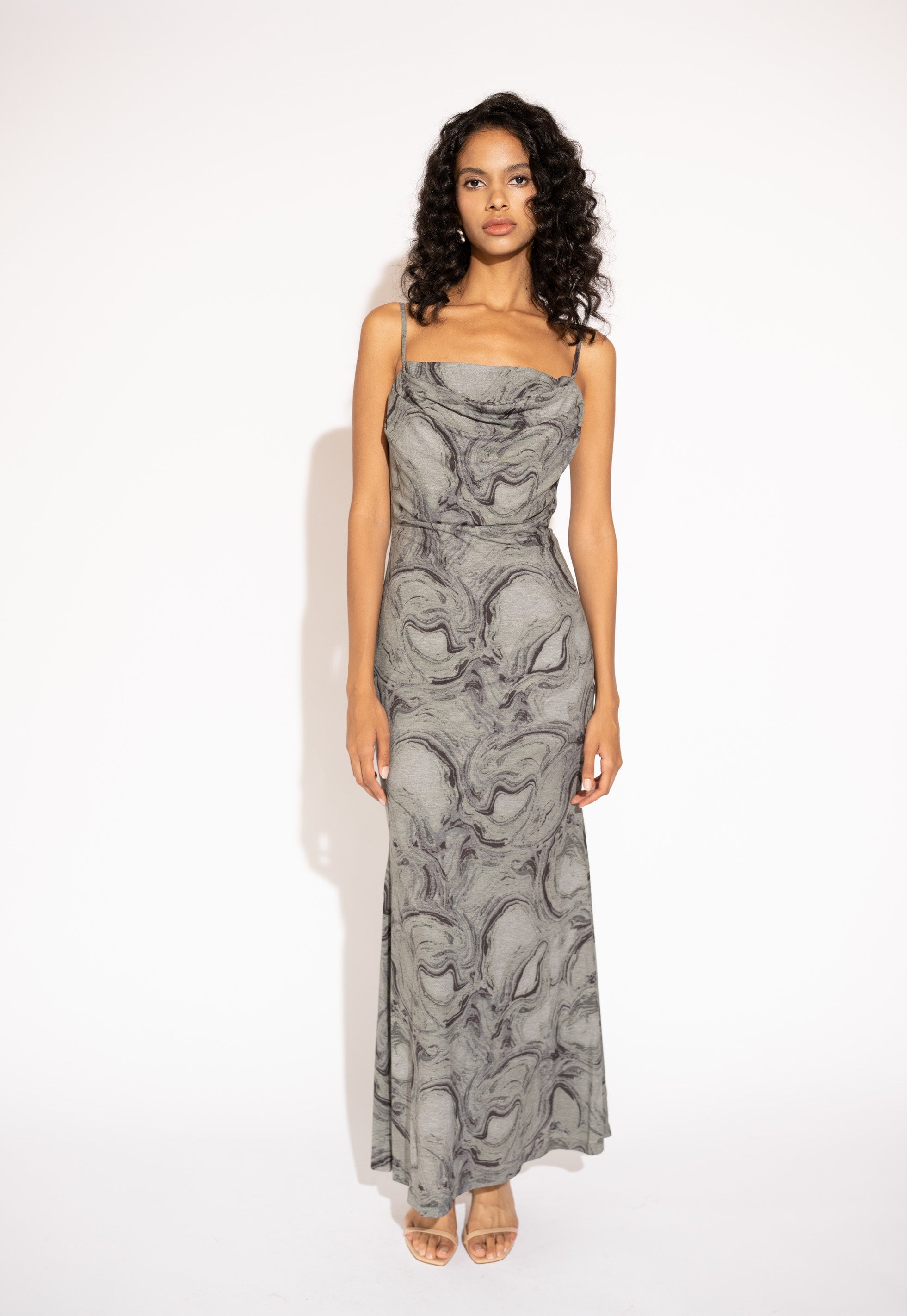 Front view with white background of Flowy Printed Maxi Dress with Spaghetti Straps – Marble Grey by Aisl. 
