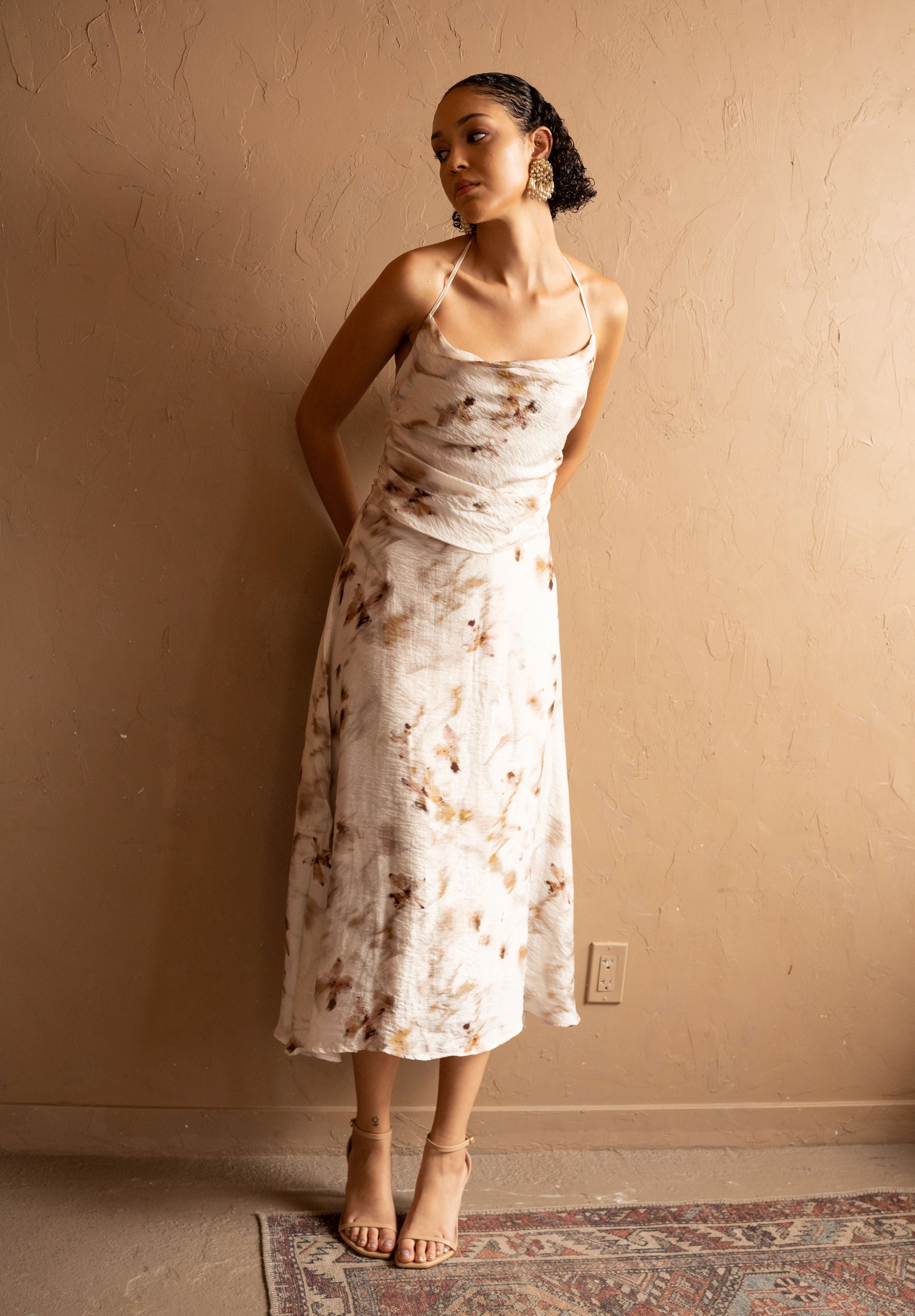 Front view of Floral Halter Midi Dress in Tencel – Ivory by Aisl. 