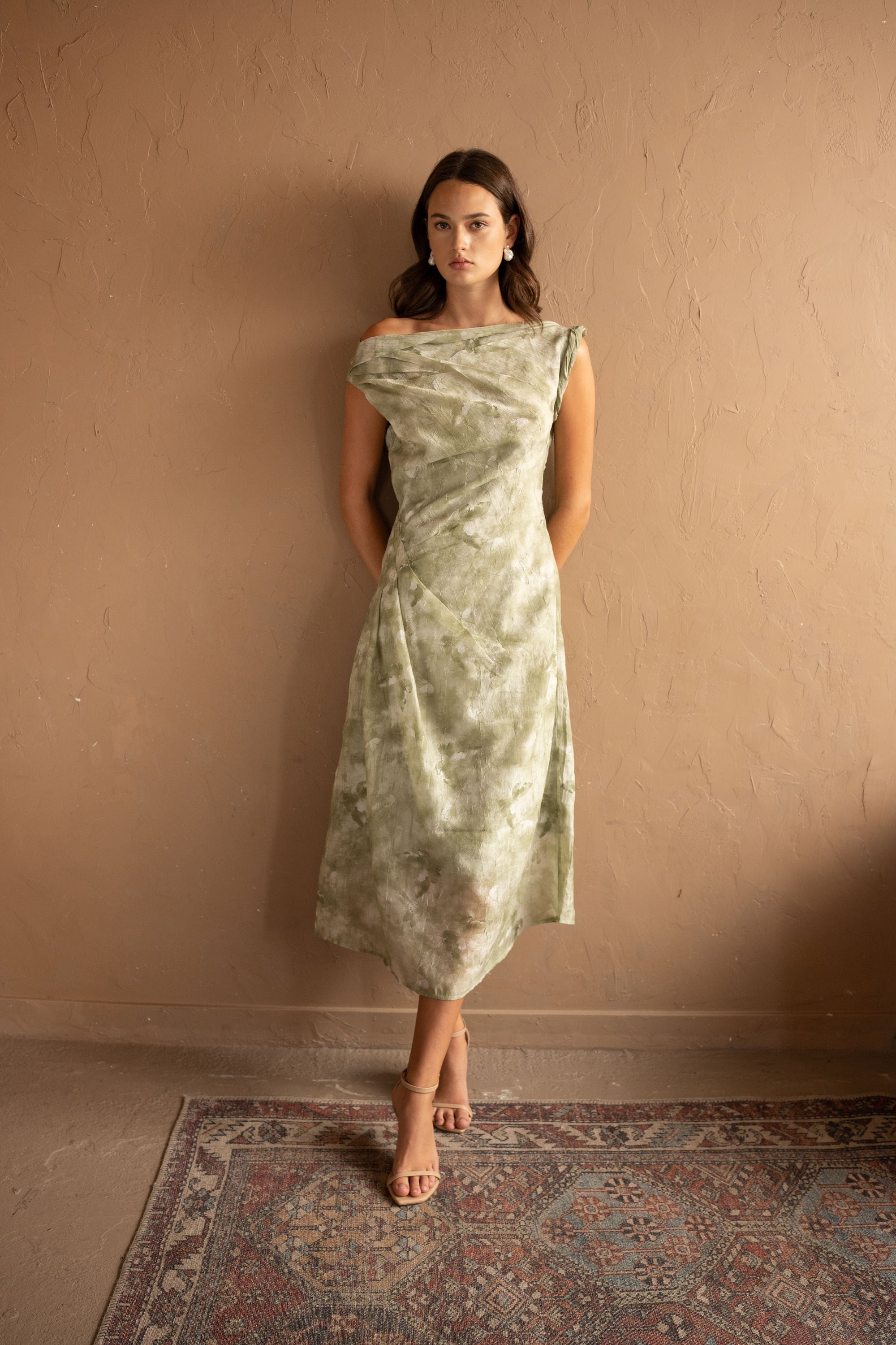 Front view of Draped Printed Midi Dress – Sage Green by Aisl. 
