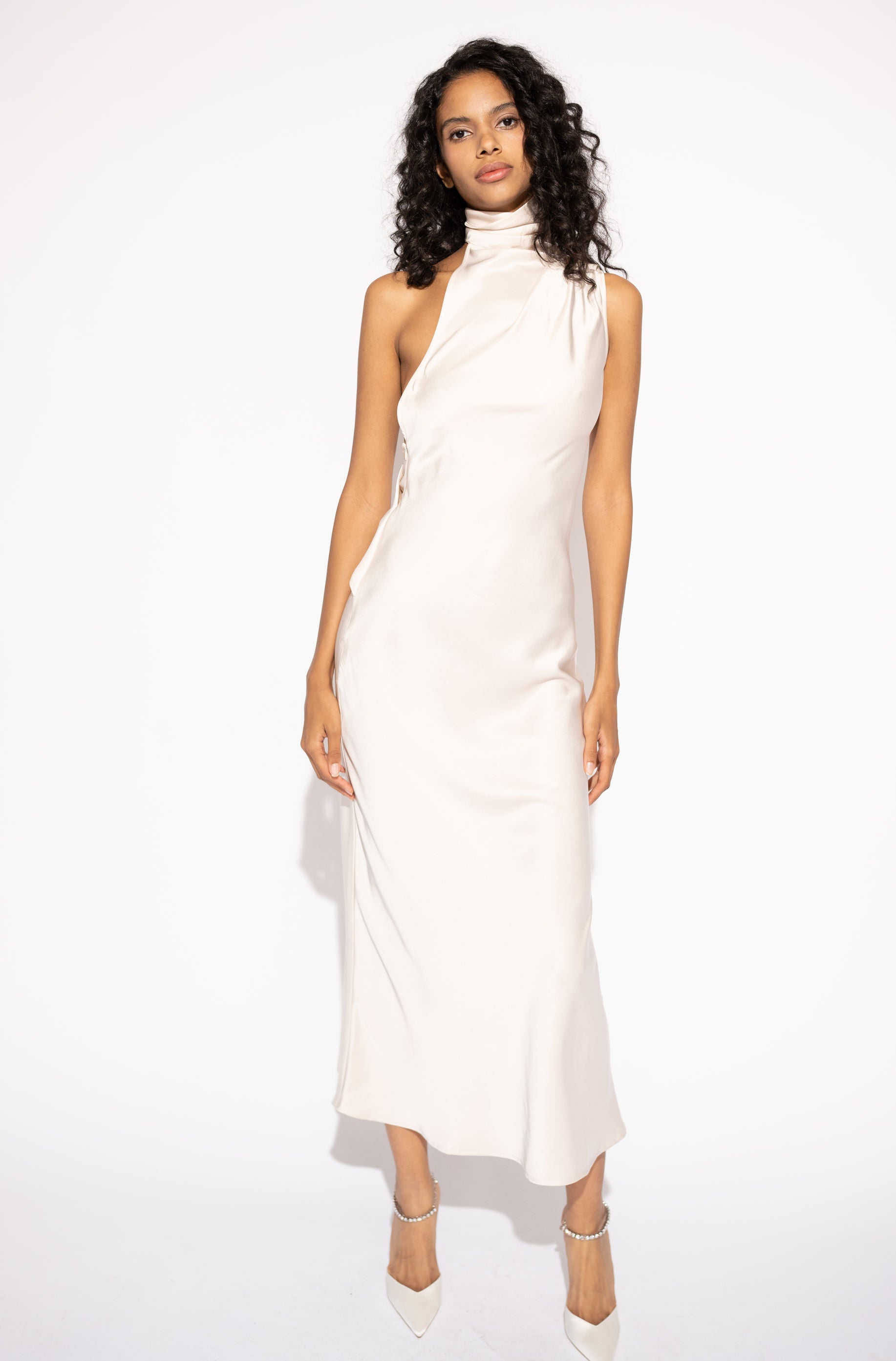 Front view with white background of Asymmetrical High-Neck Long Maxi Dress – Ivory by Aisl. 